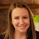 Woman with brown hair smiling at camera